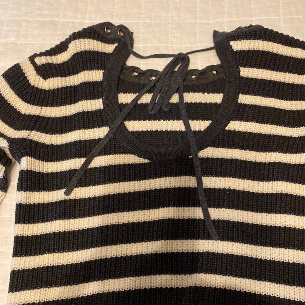 Gray and white striped sweater.